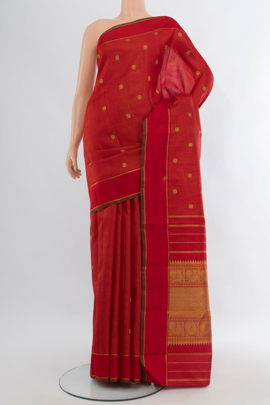Pure Silk Pure Zari Red Kanjivaram Saree with Checked design on the body and Plain Border.  displayed on a mannequin