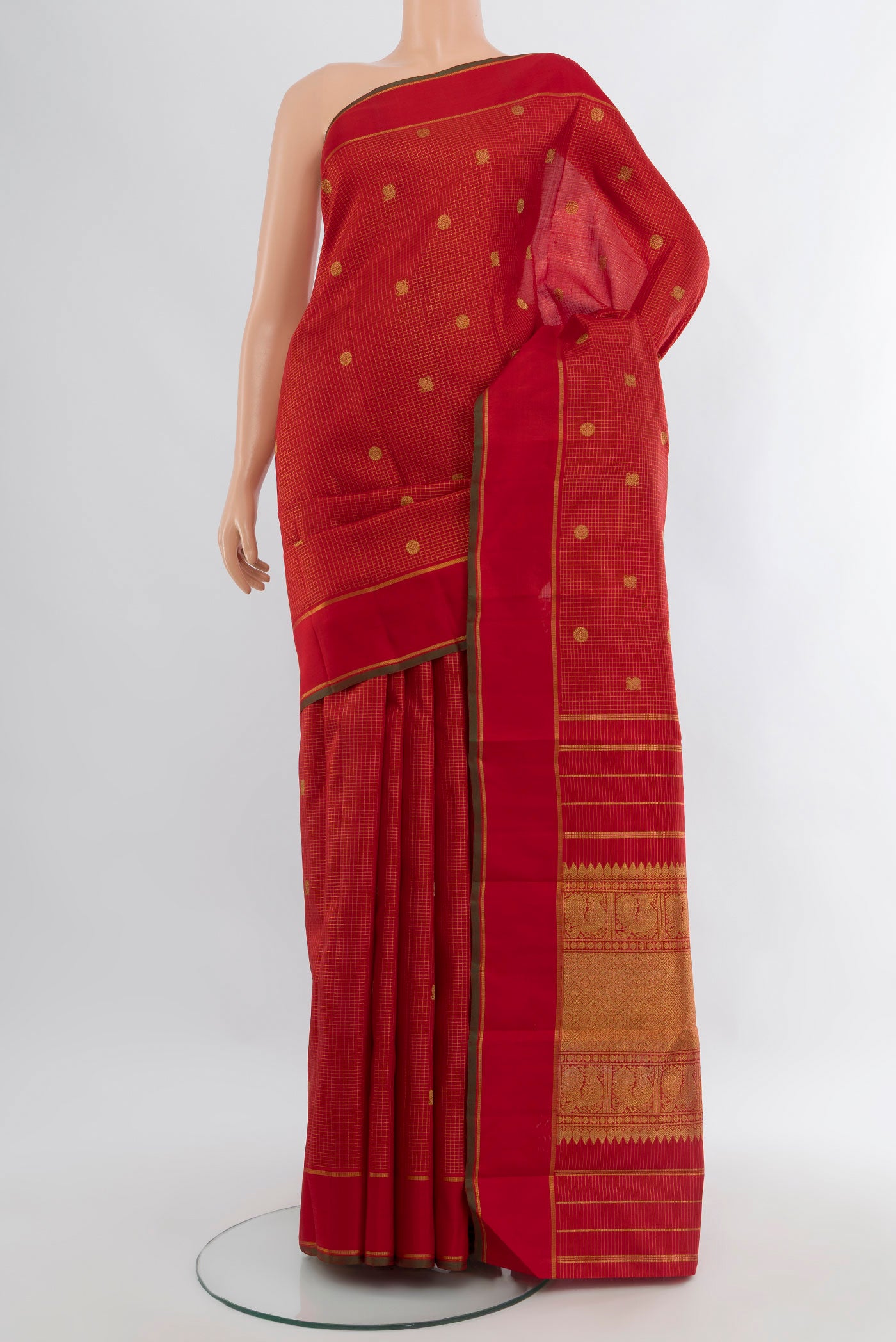 Pure Silk Pure Zari Red Kanjivaram Saree with Checked design on the body and Plain Border.  displayed on a mannequin