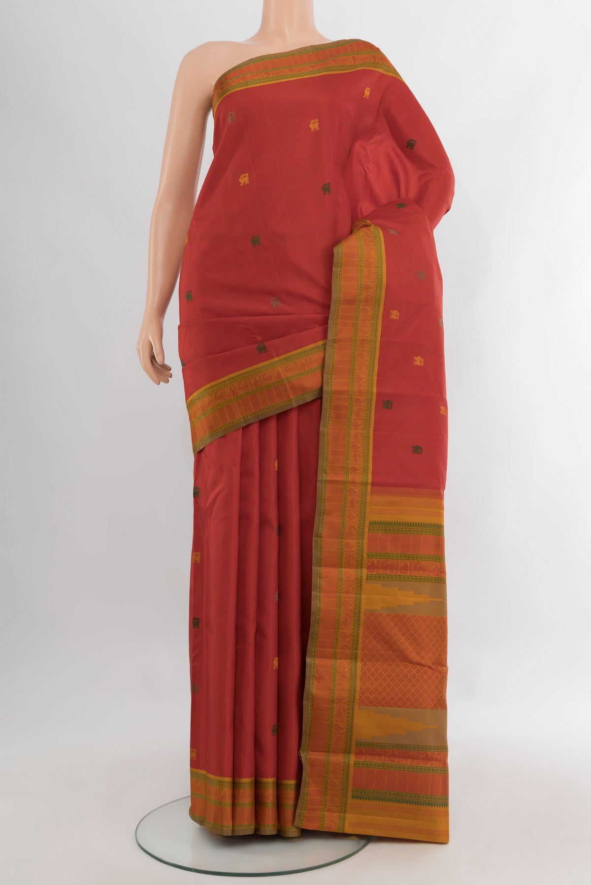 Red Kanjivaram Silk Saree with Thread Butta on the body and Thread Border.  displayed on a mannequin