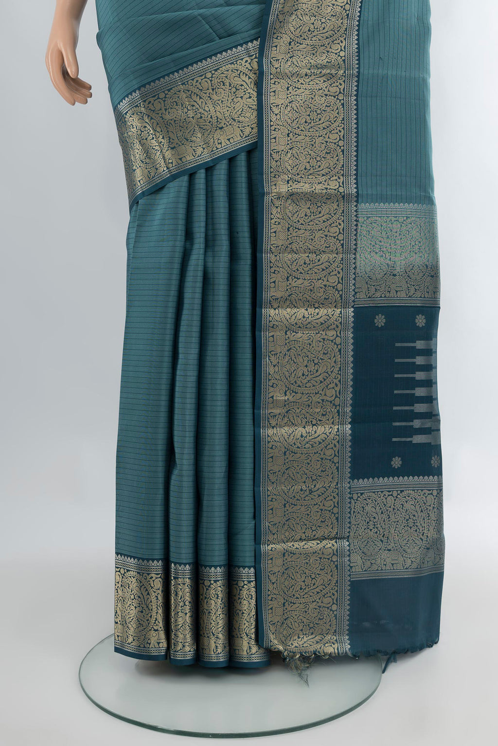 Pleats and pallu of Blue Grey Kanchipuram Silk Saree with Stripes on the body and Zari Border. 