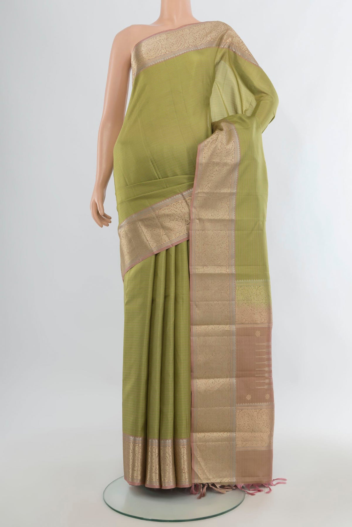 Pure Silk Light Green Kanchipuram Saree with Stripes on the body and Zari Border.  displayed on a mannequin