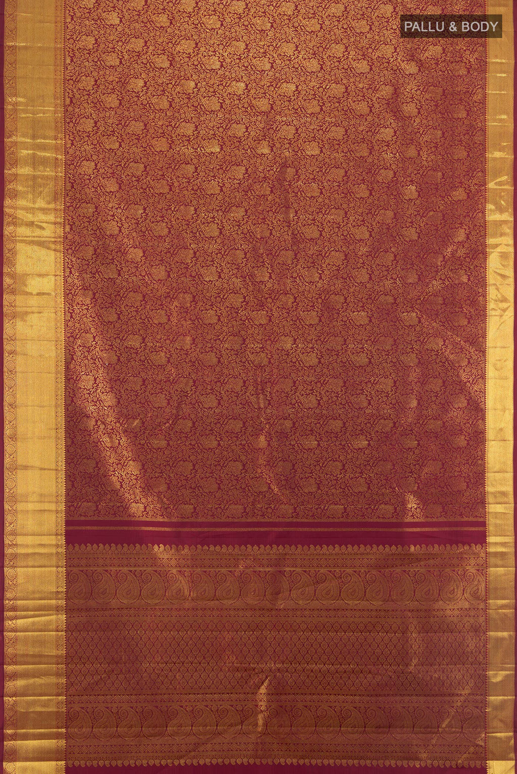Flat view of Maroon Kanchipuram Silk Saree with Zari Brocade on the body and Zari Border. 