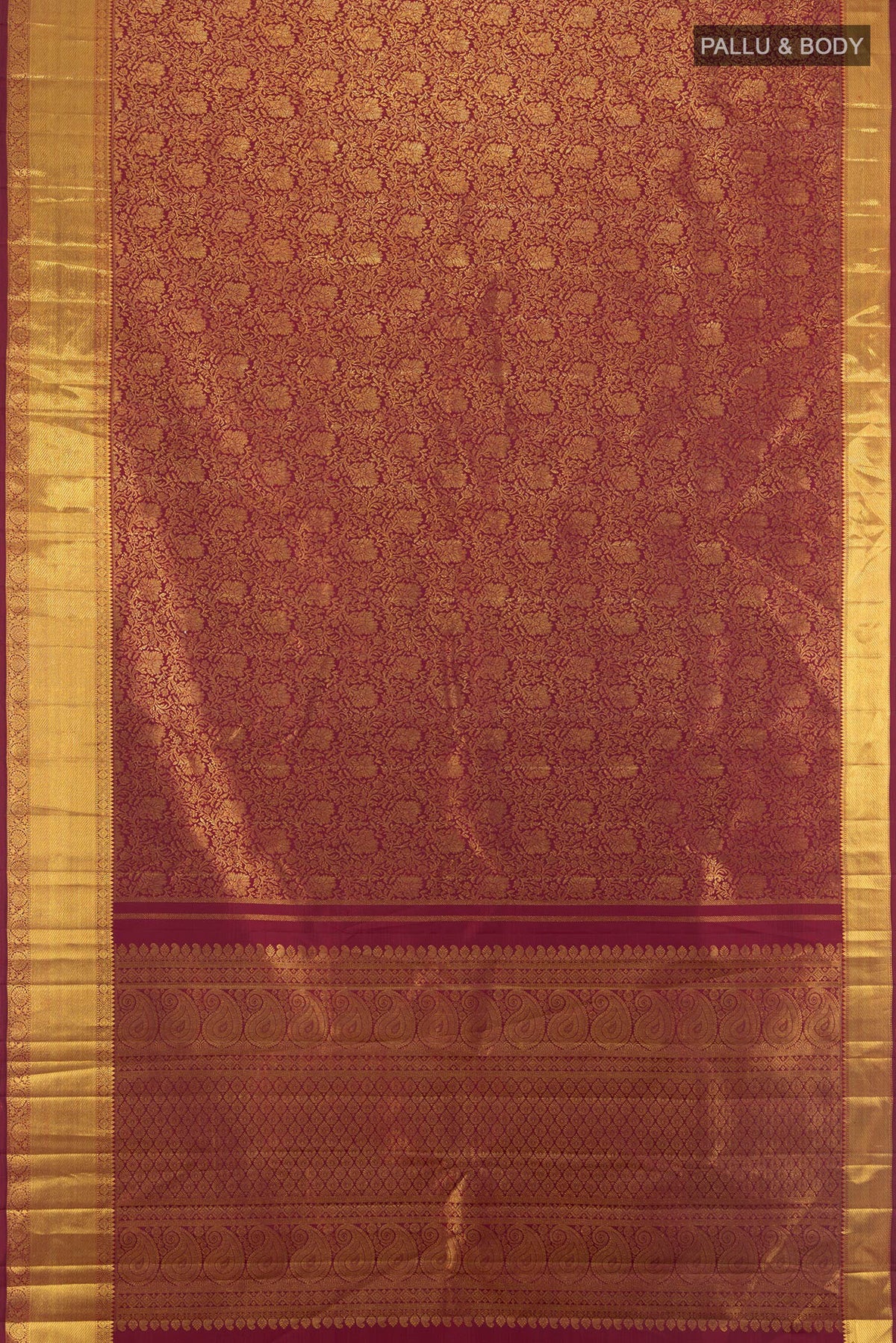 Flat view of Maroon Kanchipuram Silk Saree with Zari Brocade on the body and Zari Border. 