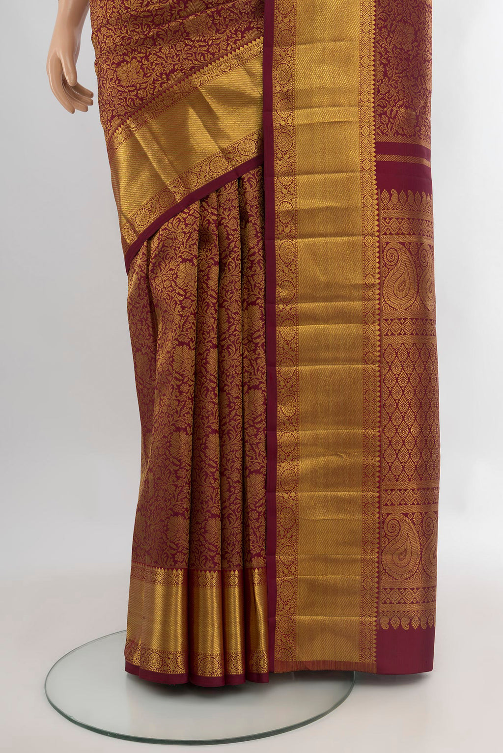 Pleats and pallu of Maroon Kanchipuram Silk Saree with Zari Brocade on the body and Zari Border. 