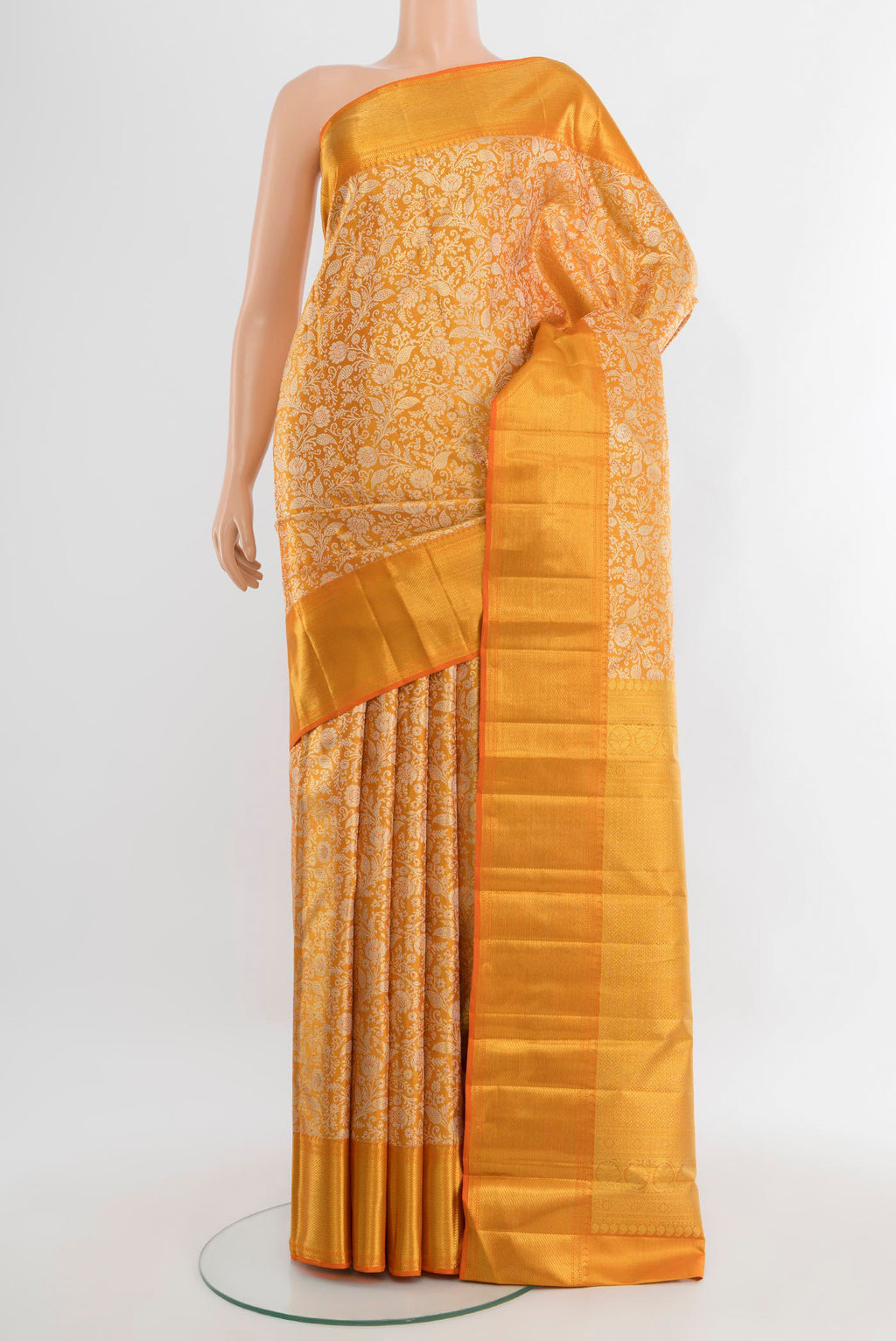 Pure Silk Pure Zari Golden Kanjivaram Tissue Saree with Zari Brocade on the body and Zari Border.  displayed on a mannequin