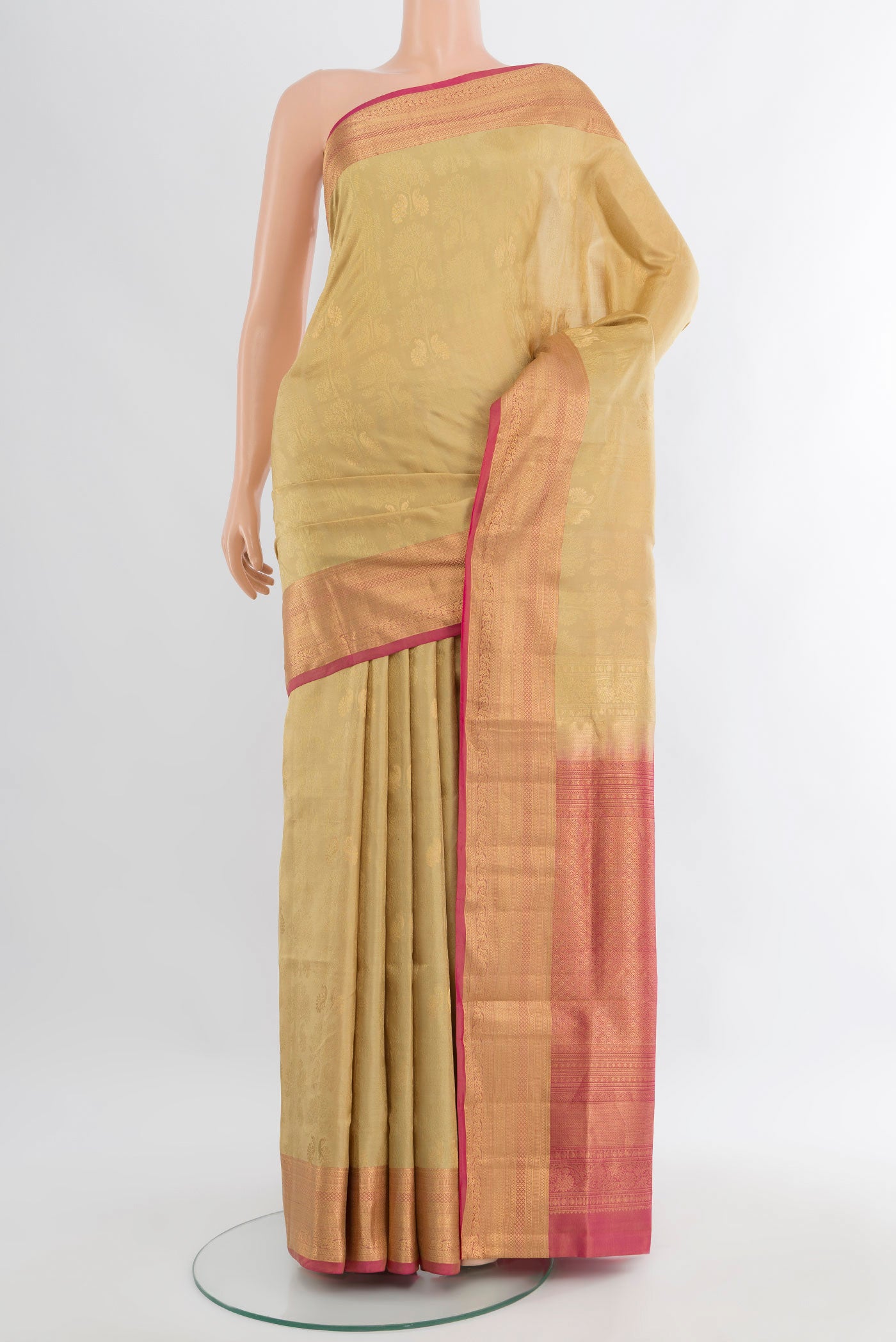 Beige Soft Silk Saree with Zari Butta on the body and Zari Border.  displayed on a mannequin