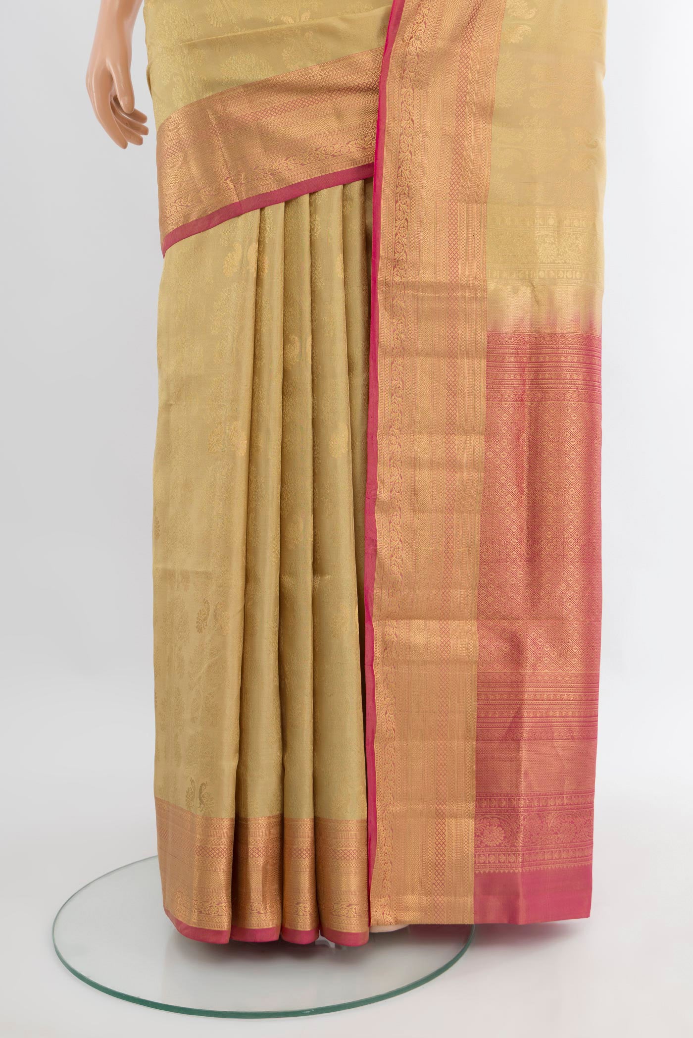 Pleats and pallu of Beige Soft Silk Saree with Zari Butta on the body and Zari Border. 