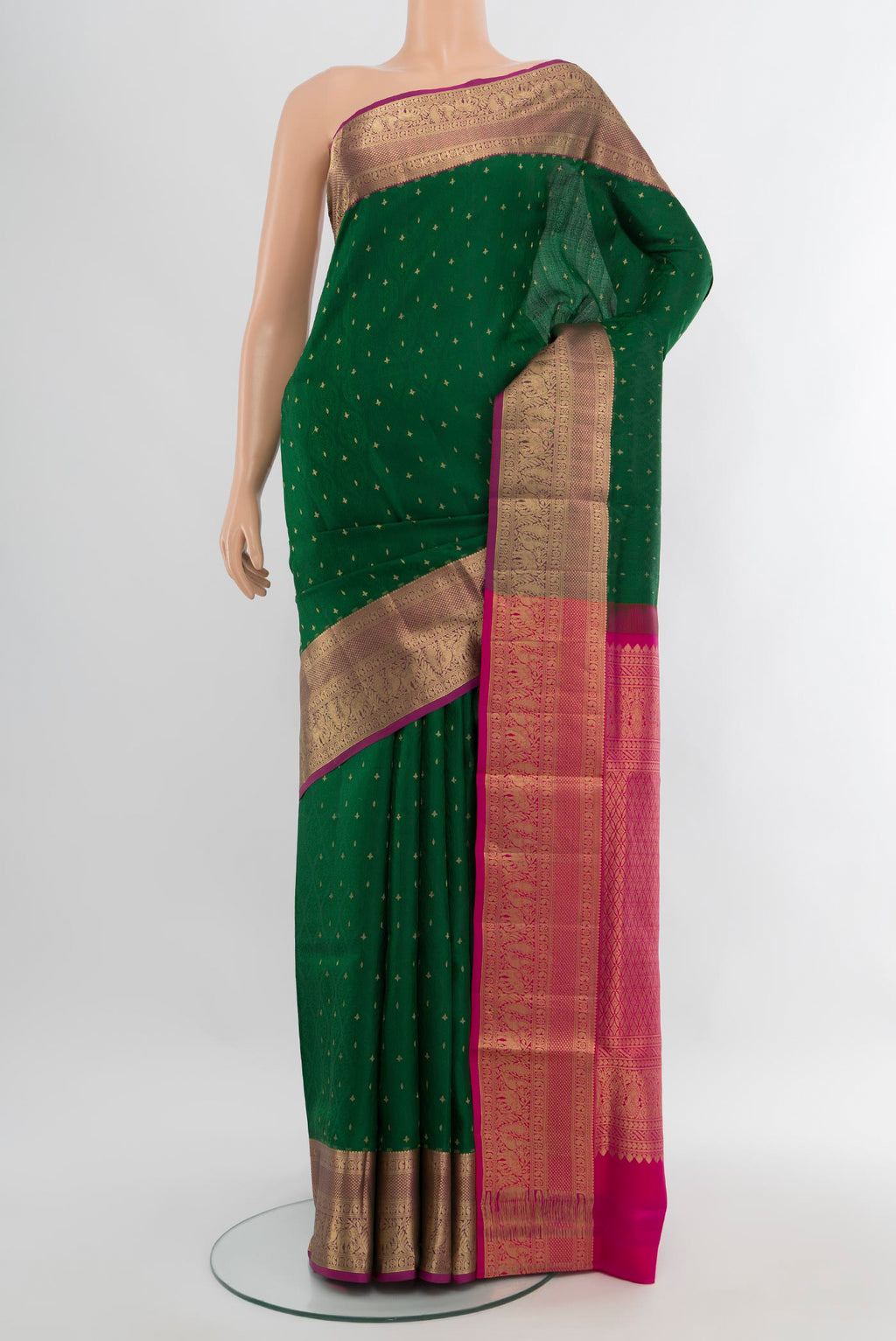 Bottle Green Soft Silk Saree with Jacquard With Zari Butta on the body and Zari Border.  displayed on a mannequin