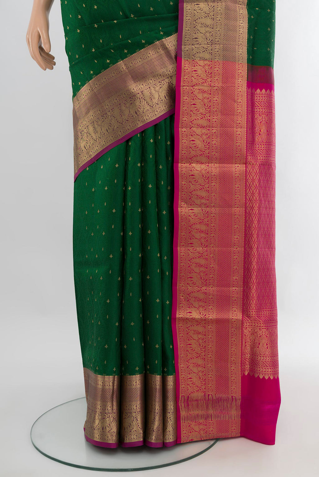 Pleats and pallu of Bottle Green Soft Silk Saree with Jacquard With Zari Butta on the body and Zari Border. 