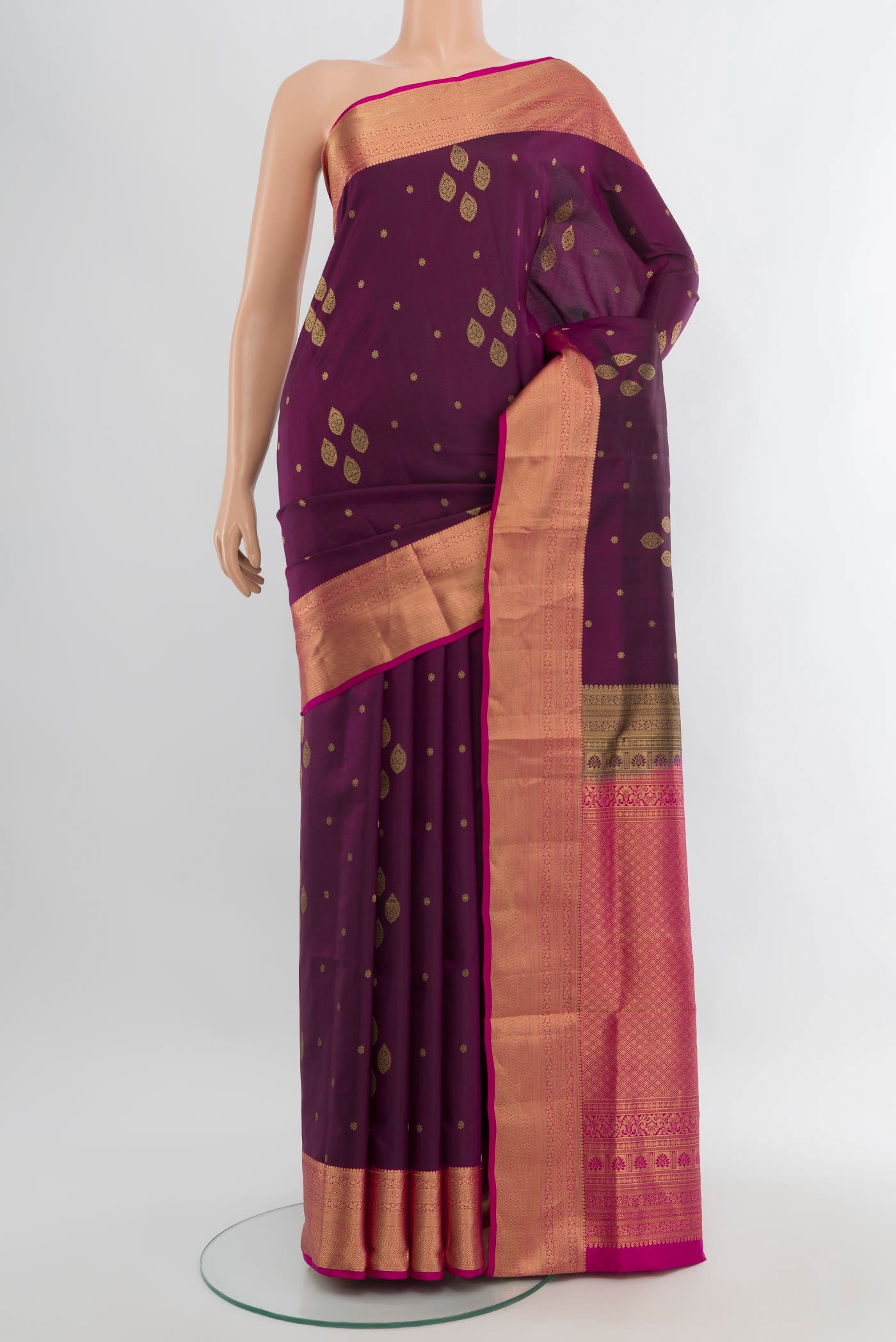 Purple Soft Silk Saree with Zari Butta on the body and Zari Border.  displayed on a mannequin