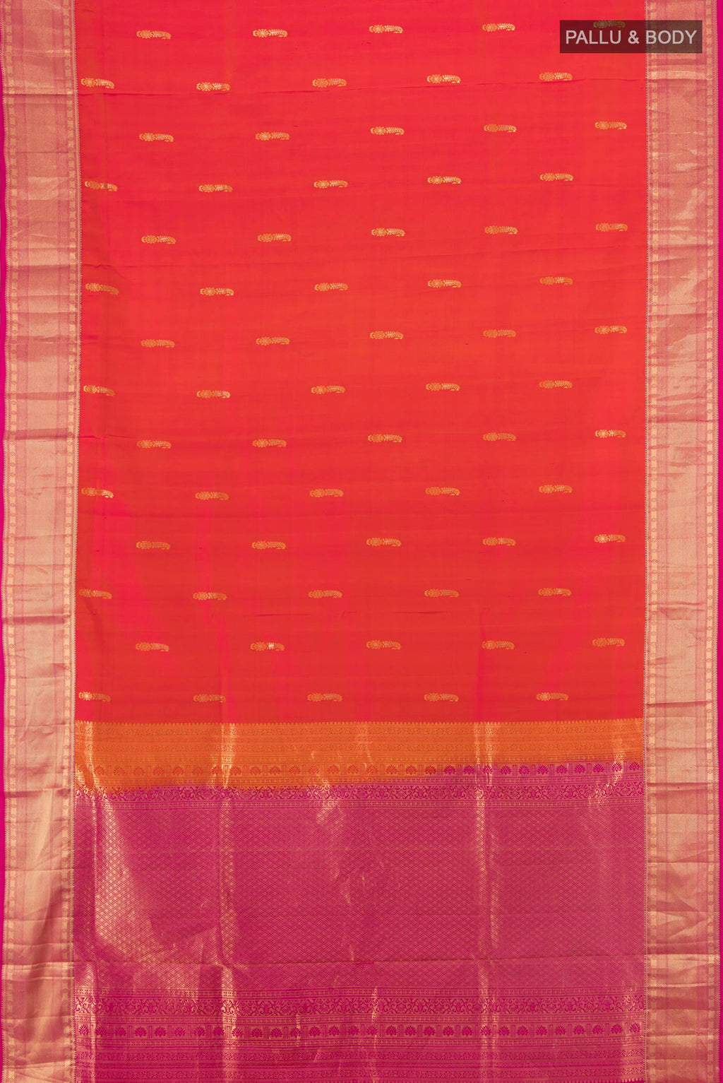 Flat view of Brick Orange Soft Silk Saree with Zari Butta on the body and Zari Border. 
