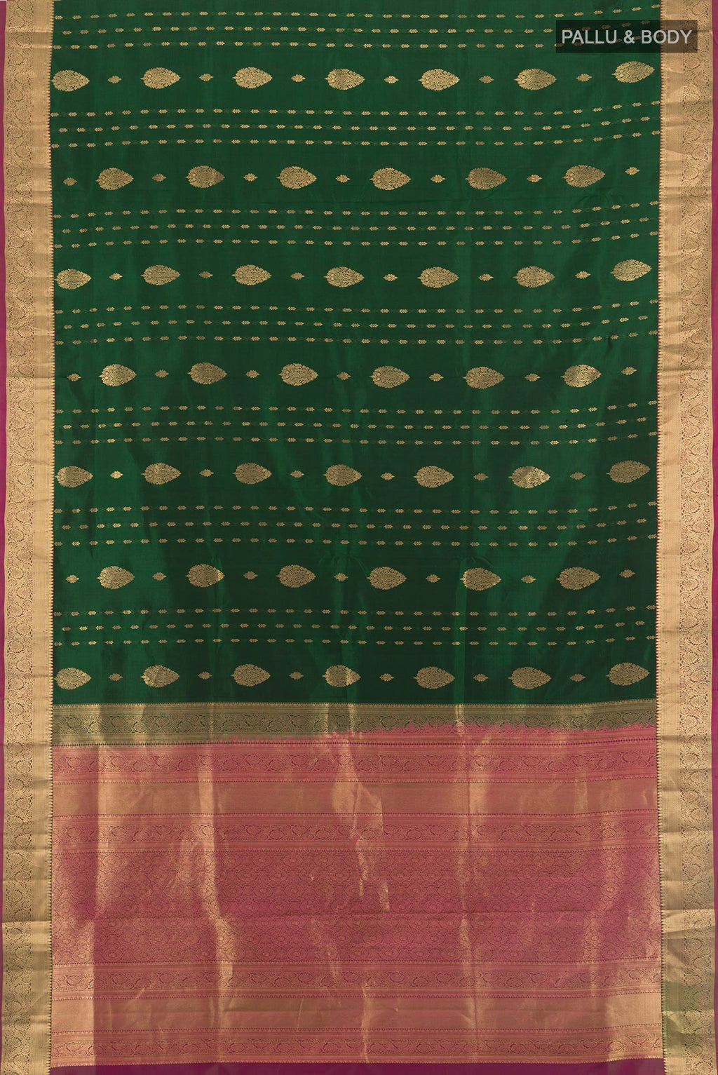 Flat view of Bottle Green Soft Silk Saree with Zari Butta on the body and Zari Border. 