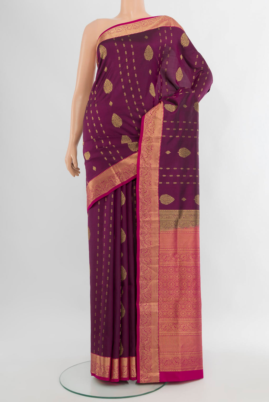 Purple Soft Silk Saree with Zari Butta on the body and Zari Border.  displayed on a mannequin