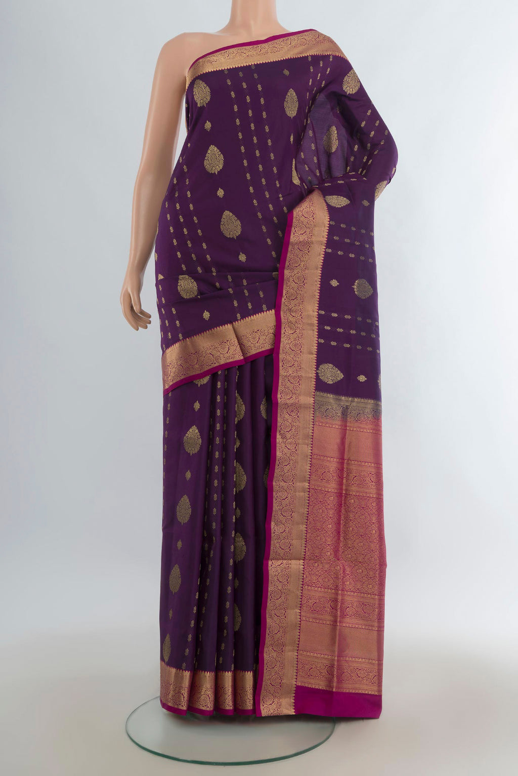 Pure Silk Purple Soft Saree with Zari Butta on the body and Zari Border.  displayed on a mannequin