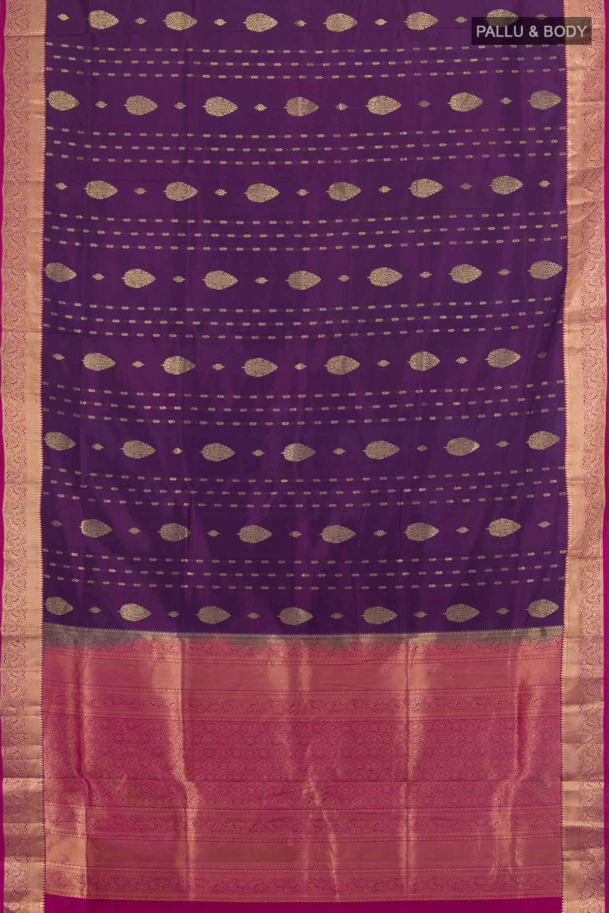 Flat view of Pure Silk Purple Soft Saree with Zari Butta on the body and Zari Border. 