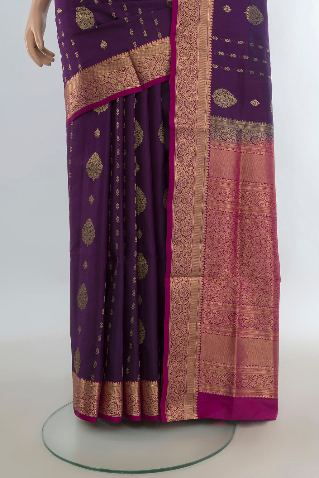 Pleats and pallu of Pure Silk Purple Soft Saree with Zari Butta on the body and Zari Border. 