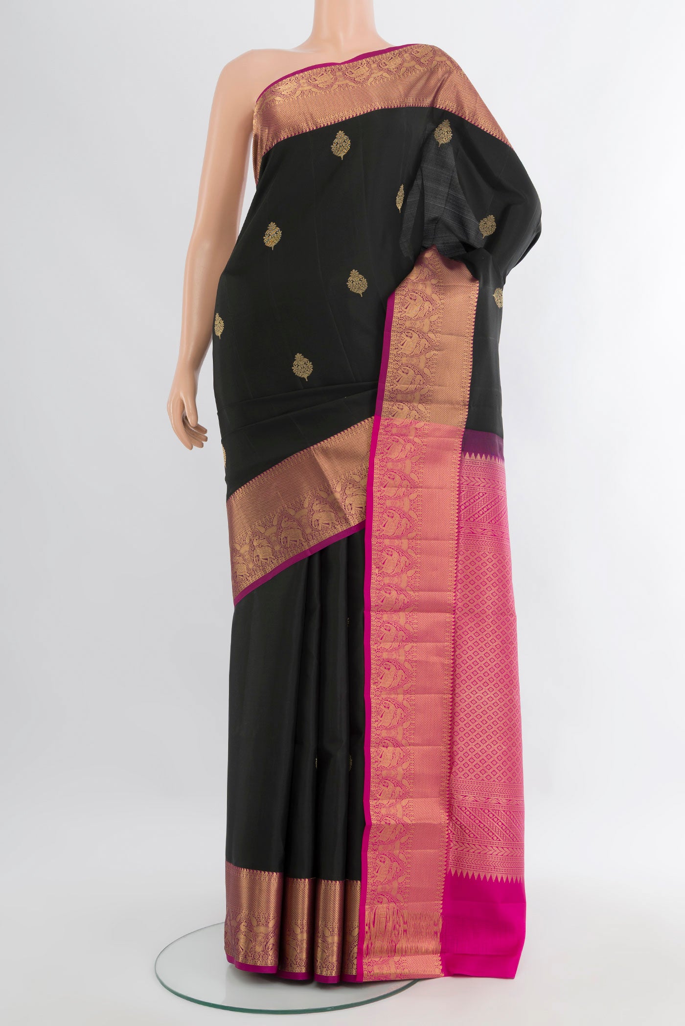 Black Soft Silk Saree with Zari Butta on the body and Zari Border.  displayed on a mannequin