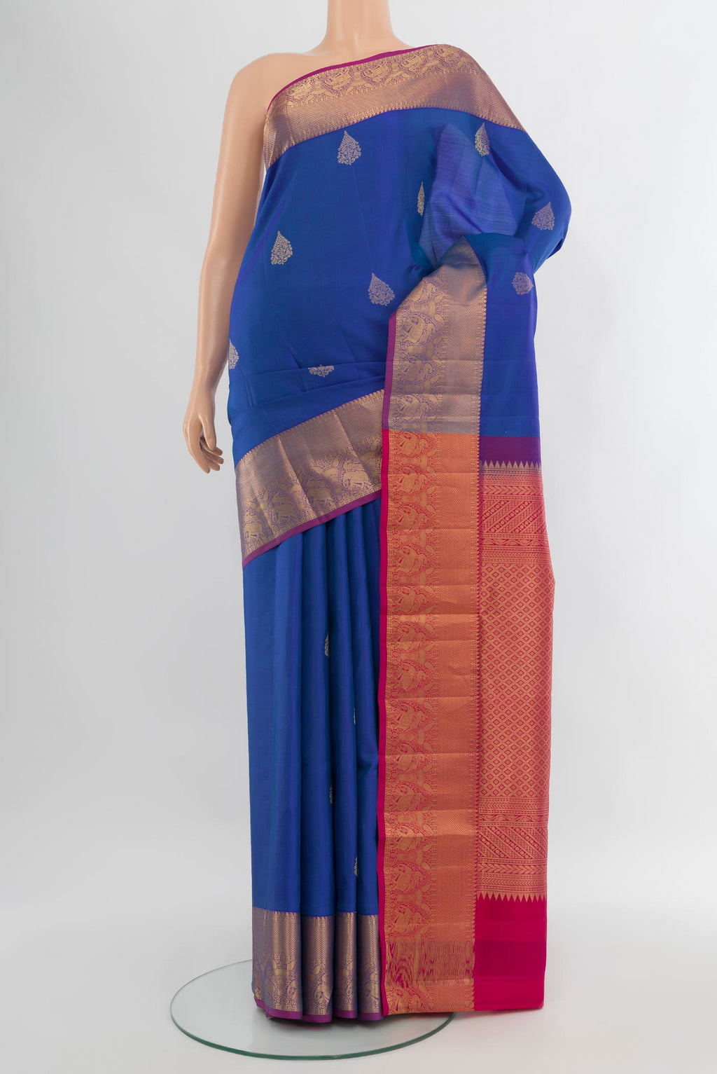 Royal Blue Soft Silk Saree with Zari Butta on the body and Zari Border.  displayed on a mannequin