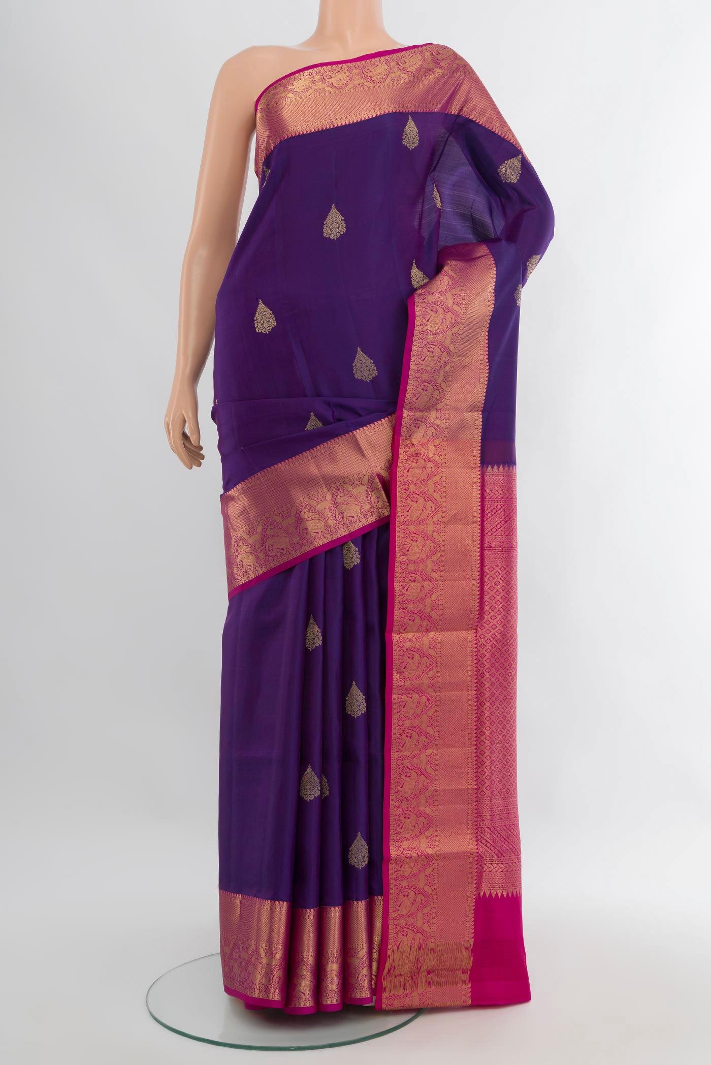 Violet Soft Silk Saree with Zari Butta on the body and Zari Border.  displayed on a mannequin