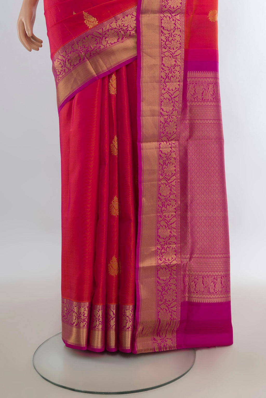 Pleats and pallu of Pure Silk Brick Orange Dual Tone Soft Saree with Zari Butta on the body and Zari Border. 