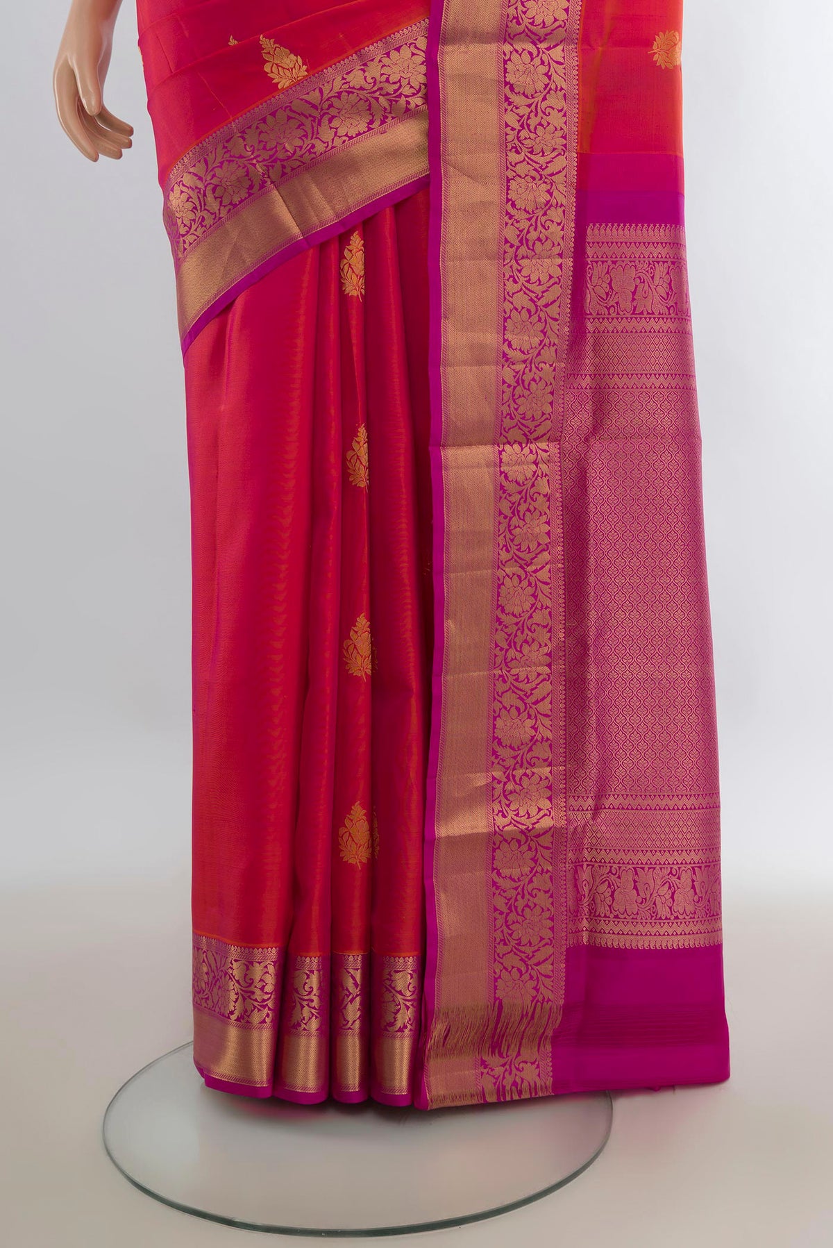 Pleats and pallu of Pure Silk Brick Orange Dual Tone Soft Saree with Zari Butta on the body and Zari Border. 