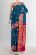 Pure Silk Peacock Blue Soft Saree with Zari Butta on the body and Zari Border.  displayed on a mannequin