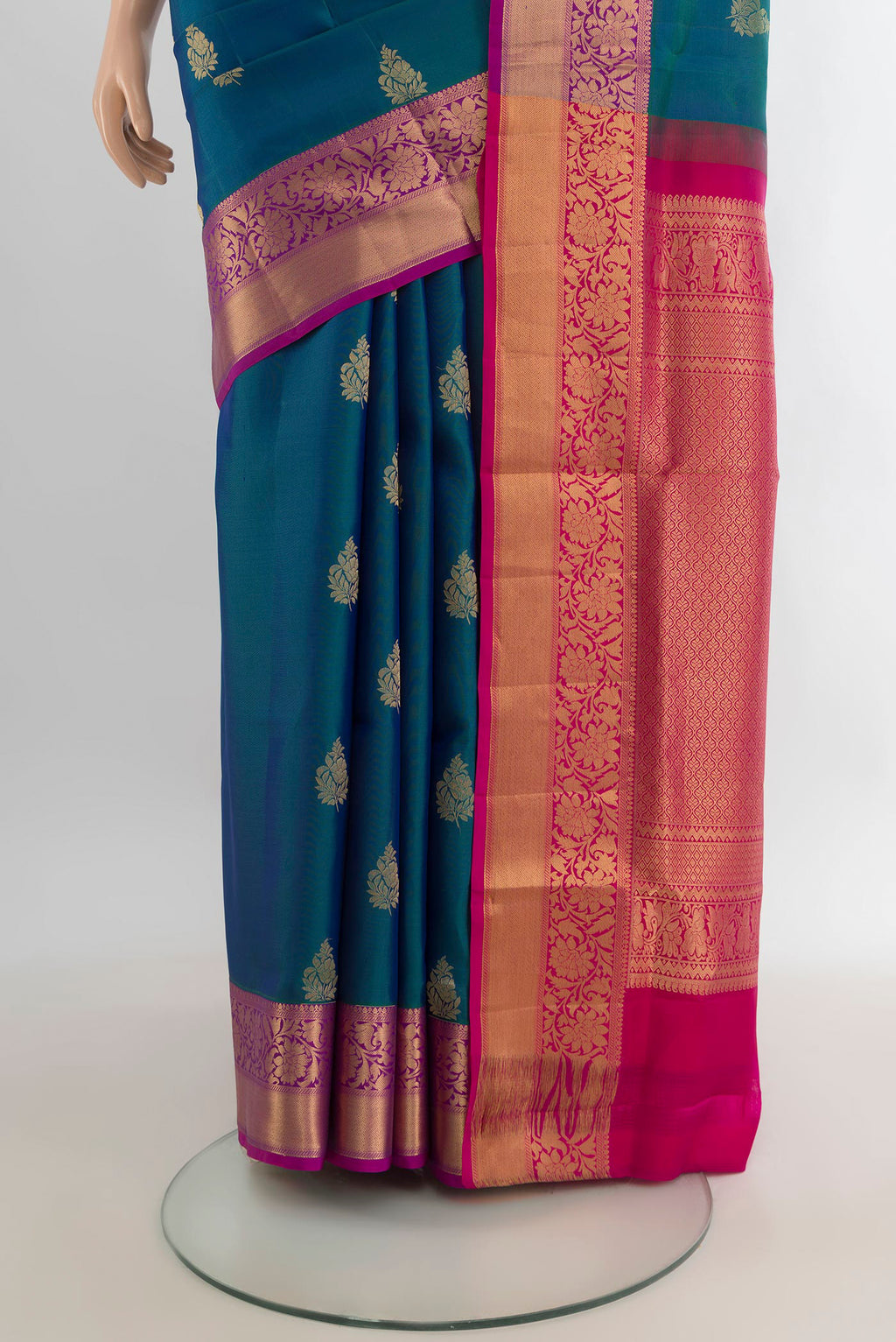 Pleats and pallu of Pure Silk Peacock Blue Soft Saree with Zari Butta on the body and Zari Border. 