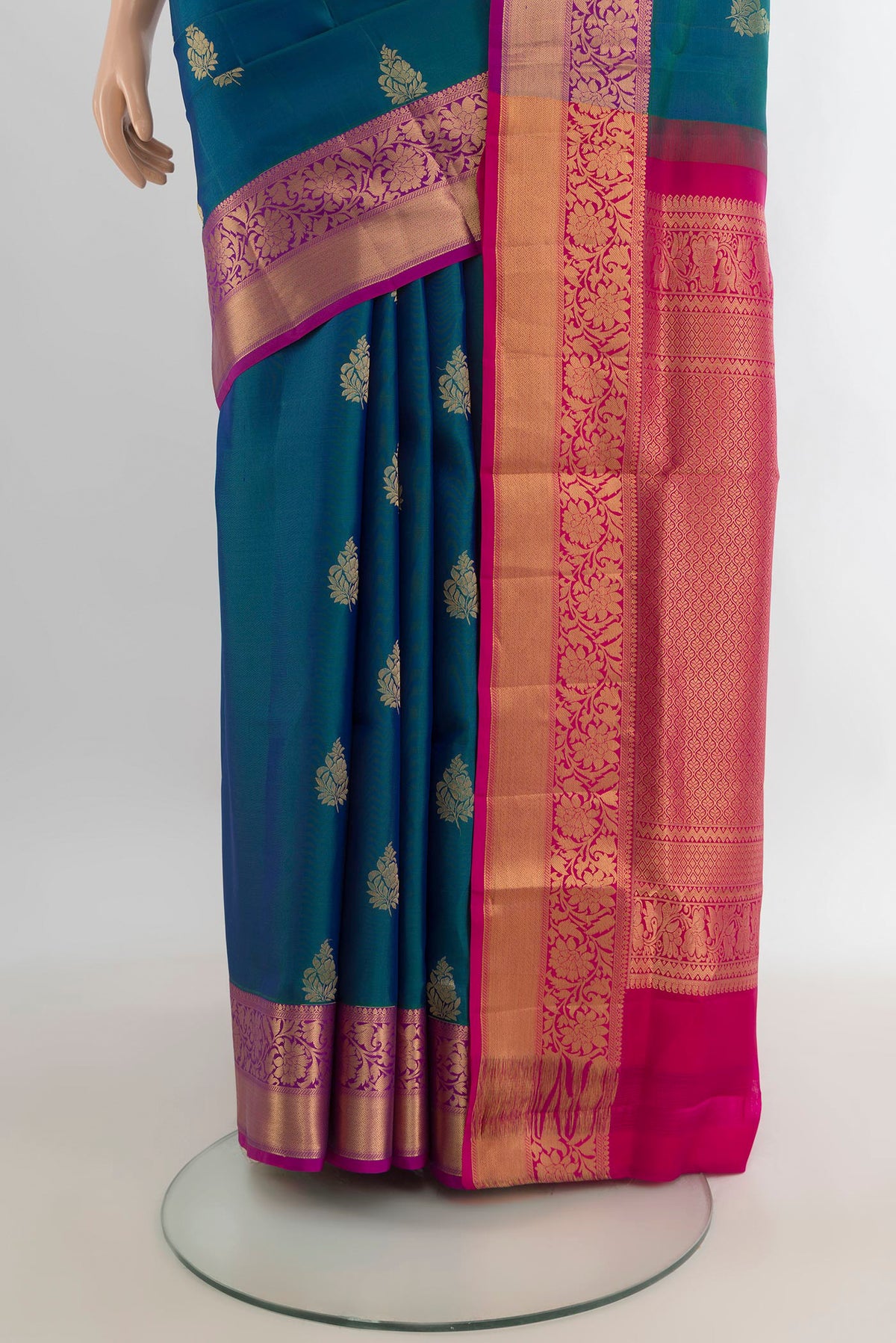 Pleats and pallu of Pure Silk Peacock Blue Soft Saree with Zari Butta on the body and Zari Border. 