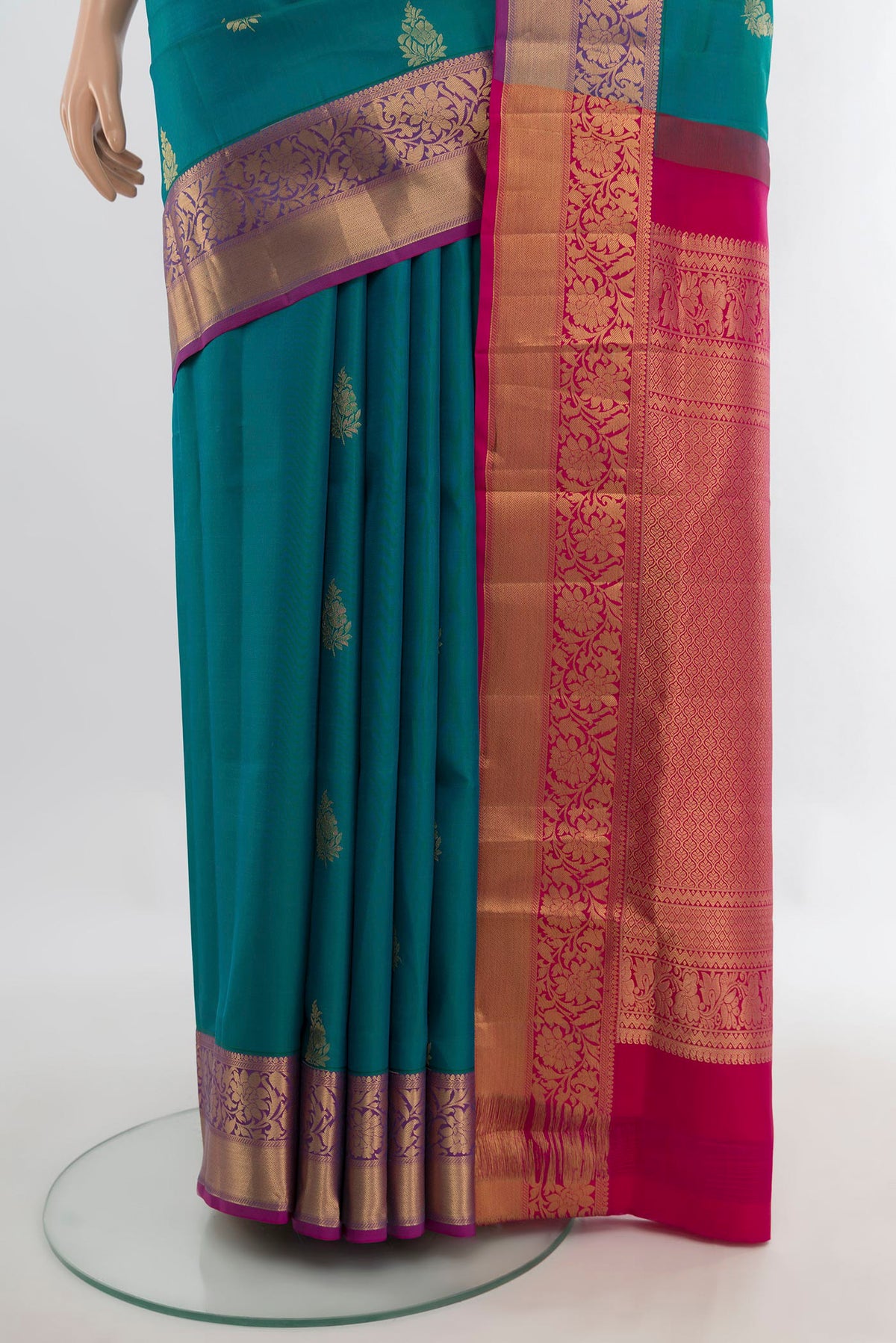 Pleats and pallu of Pure Silk Peacock Blue Soft Saree with Zari Butta on the body and Zari Border. 