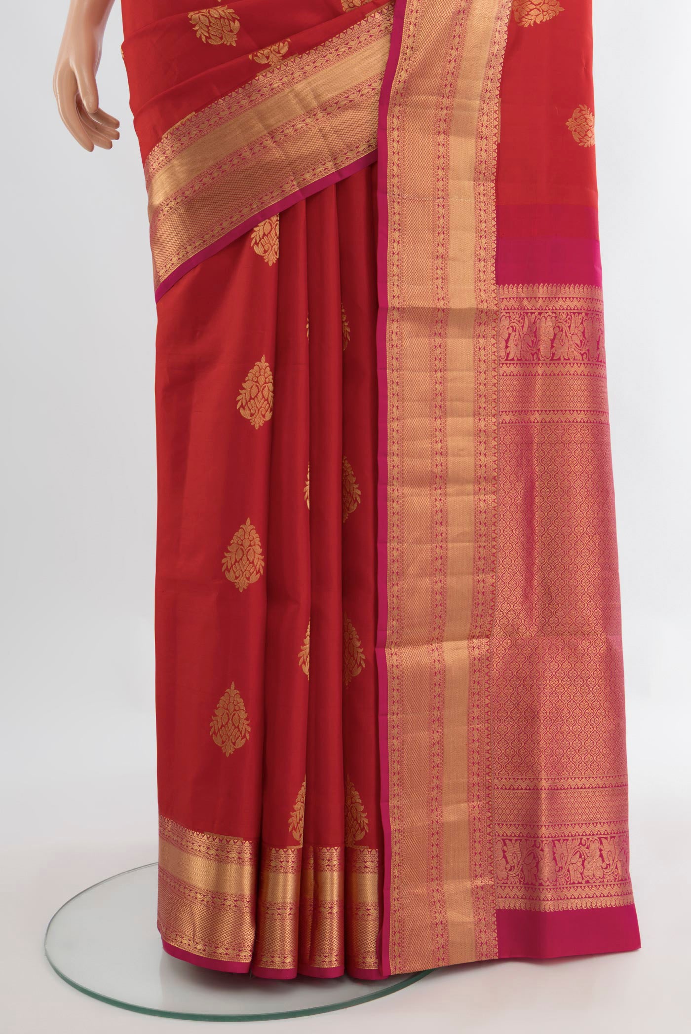 Pleats and pallu of Red Soft Silk Saree with Zari Butta on the body and Silk Border. 