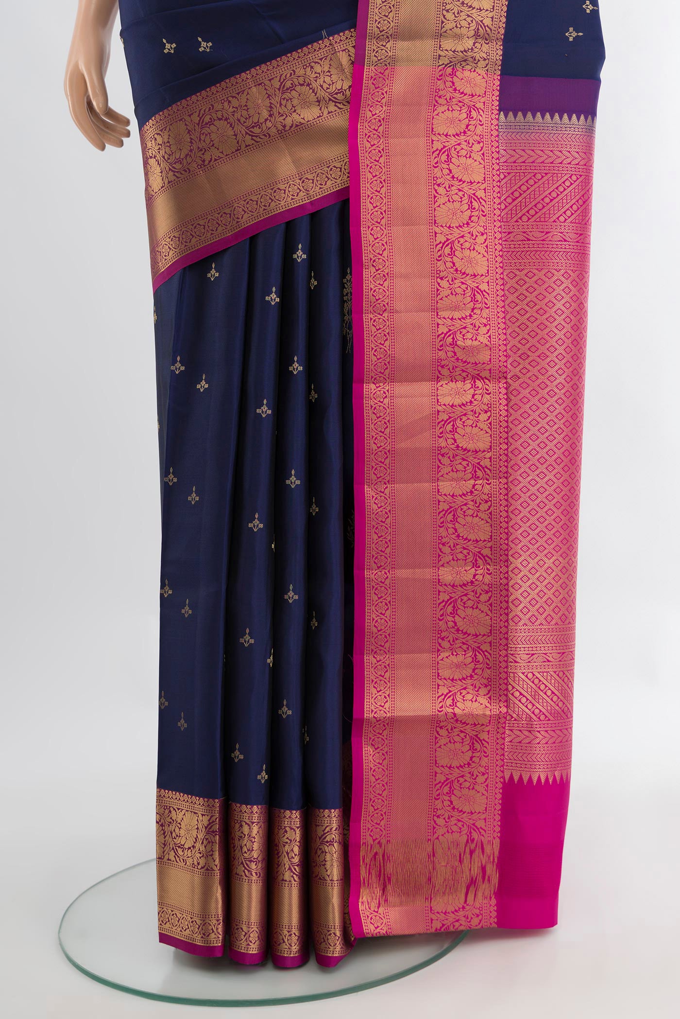 Pleats and pallu of Navy Blue Soft Silk Saree with Zari Butta on the body and Silk Border. 