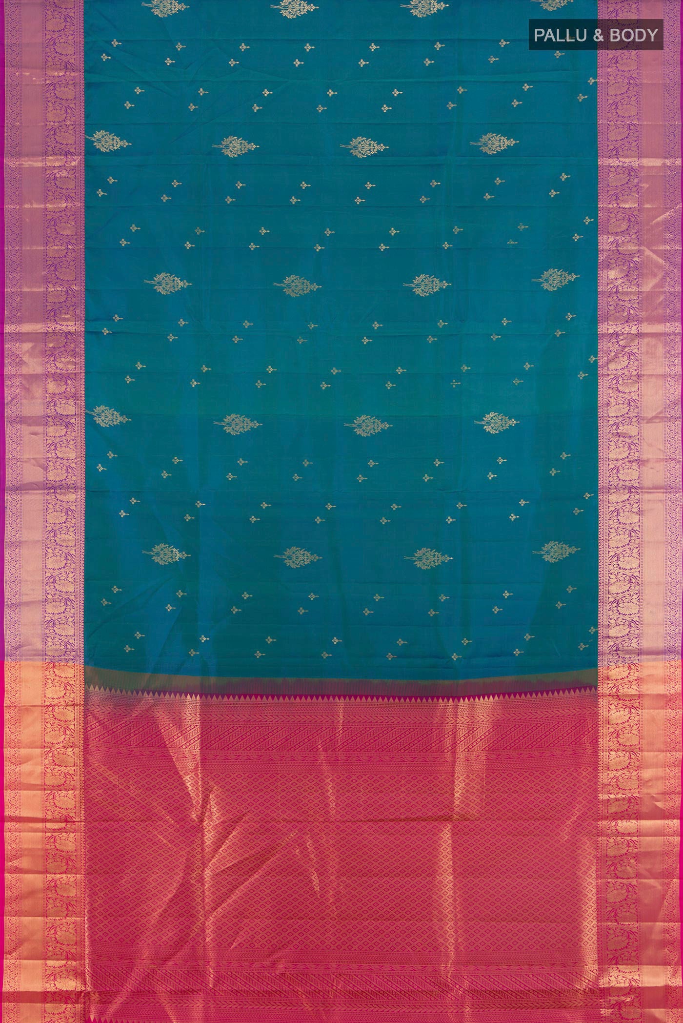 Flat view of Peacock Blue Soft Silk Saree with Zari Butta on the body and Zari Border. 