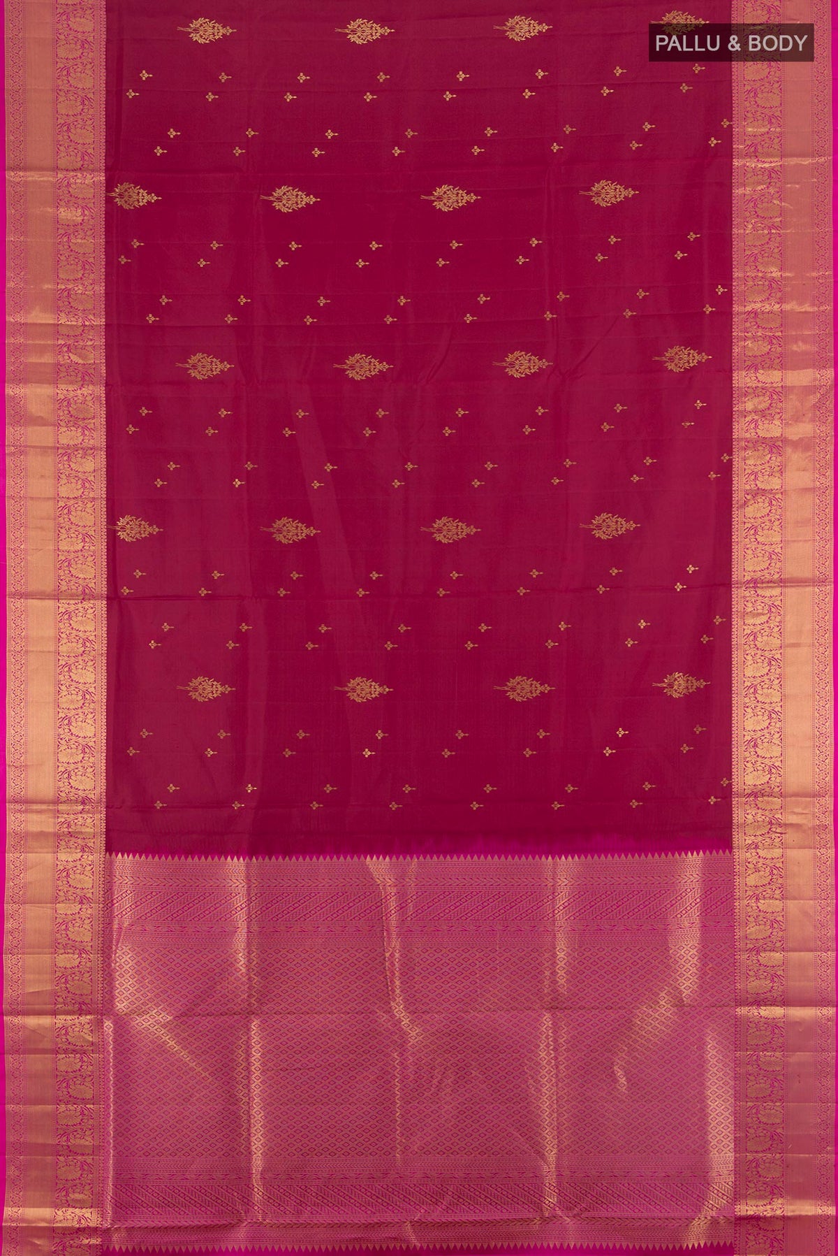 Flat view of Pure Silk Maroon Soft Saree with Zari Butta on the body and Zari Border. 