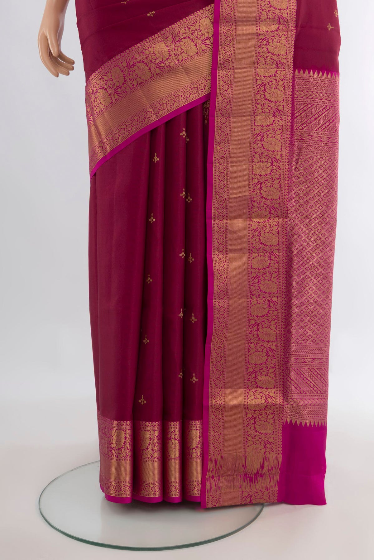 Pleats and pallu of Pure Silk Maroon Soft Saree with Zari Butta on the body and Zari Border. 