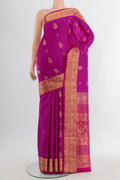 Magenta Soft Silk Saree with Zari Butta on the body and Silk Border.  displayed on a mannequin