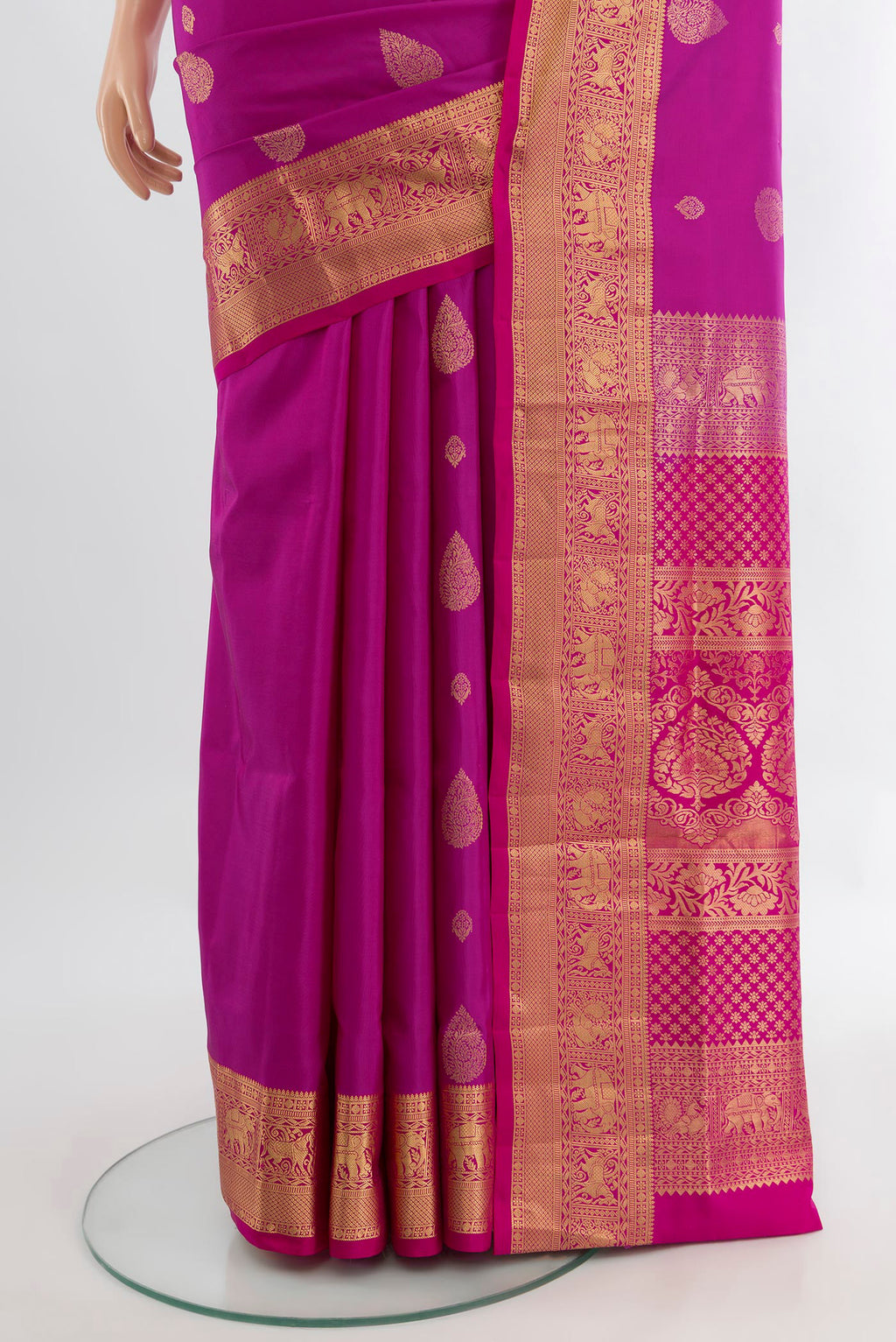 Pleats and pallu of Magenta Soft Silk Saree with Zari Butta on the body and Silk Border. 