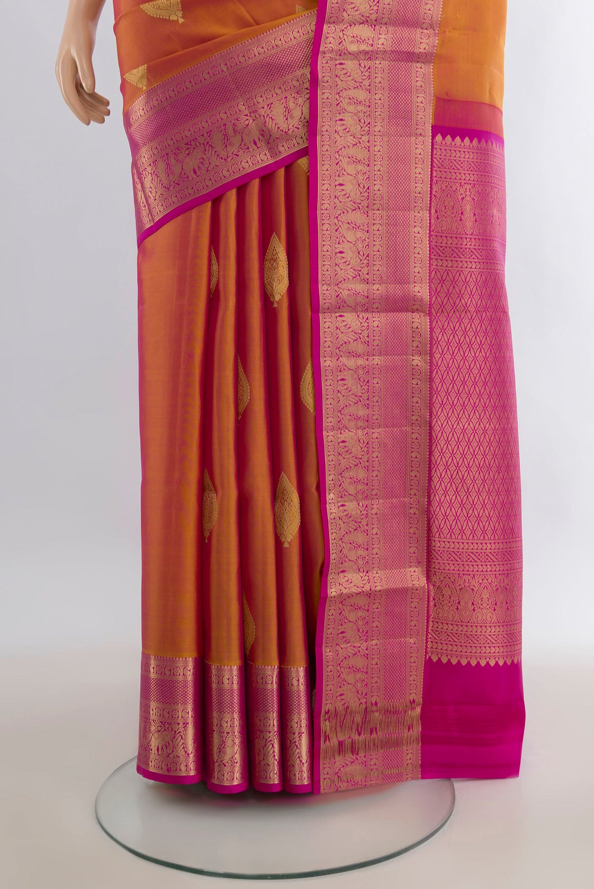 Pleats and pallu of Pure Silk Mustard Soft Saree with Zari Butta on the body and Zari Border. 