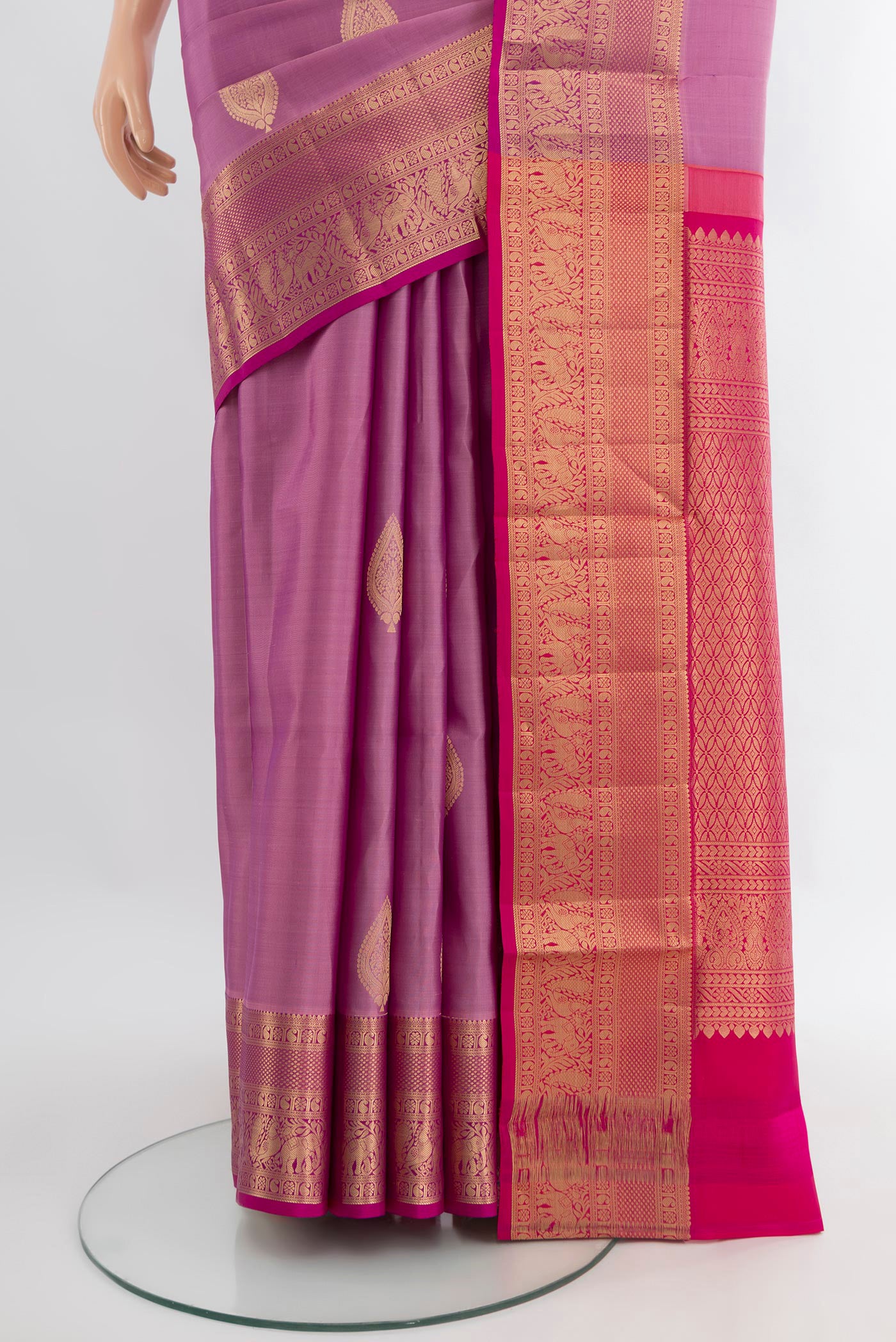 Pleats and pallu of Lavender Soft Silk Saree with Zari Butta on the body and Zari Border. 