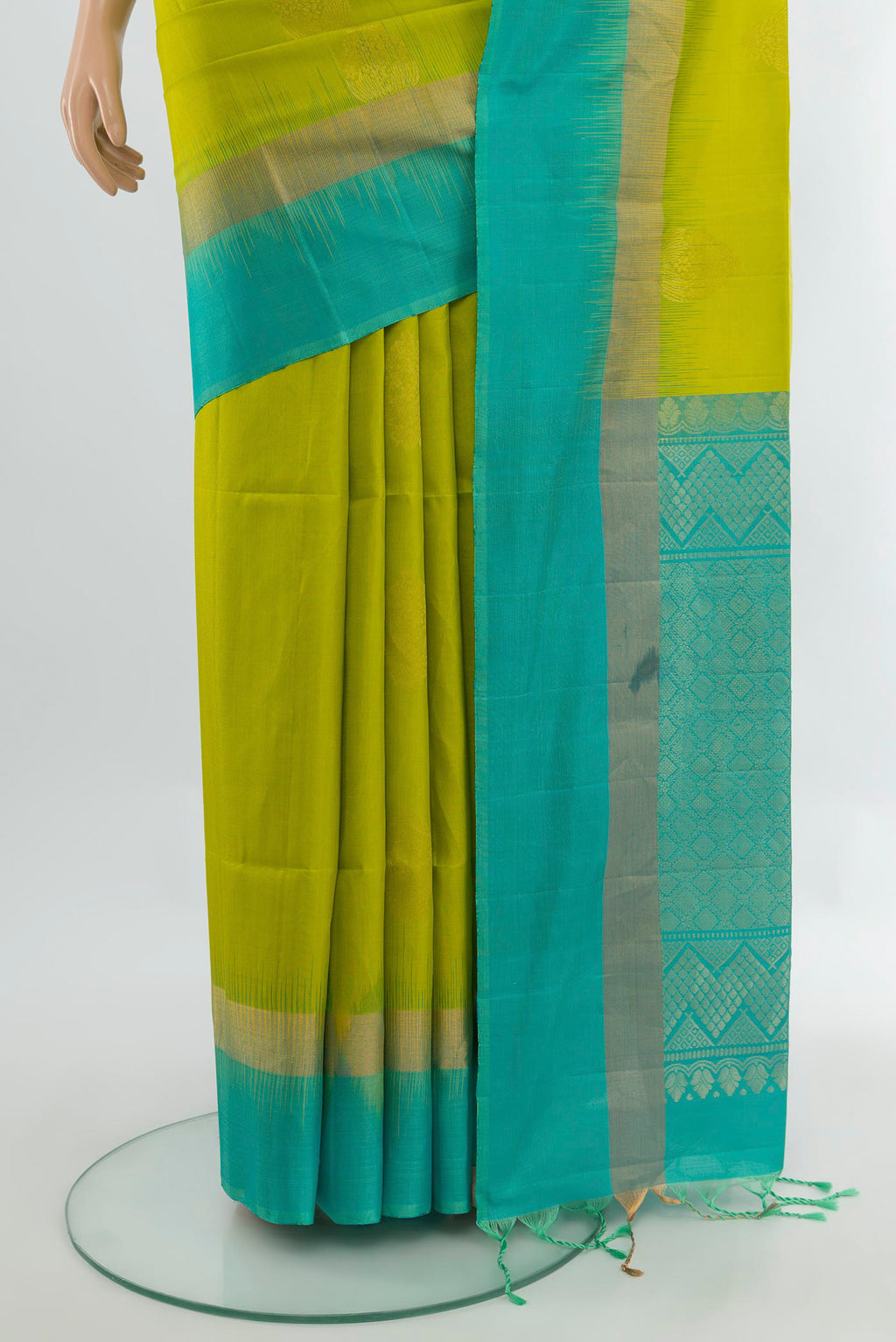 Pleats and pallu of Parrot Green Soft Silk Saree with Zari Butta on the body and Silk Border. 