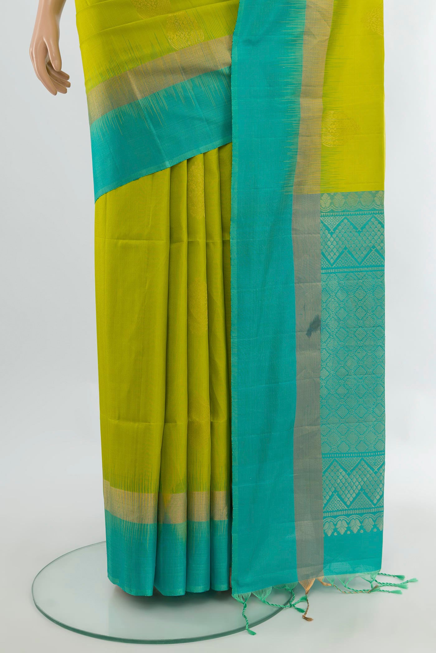 Pleats and pallu of Parrot Green Soft Silk Saree with Zari Butta on the body and Silk Border. 