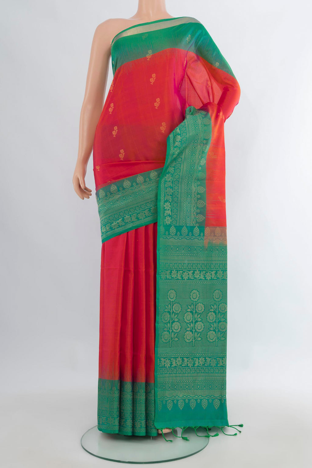 Pure Silk Brick Orange Soft Saree with Zari Butta on the body and Zari Border.  displayed on a mannequin