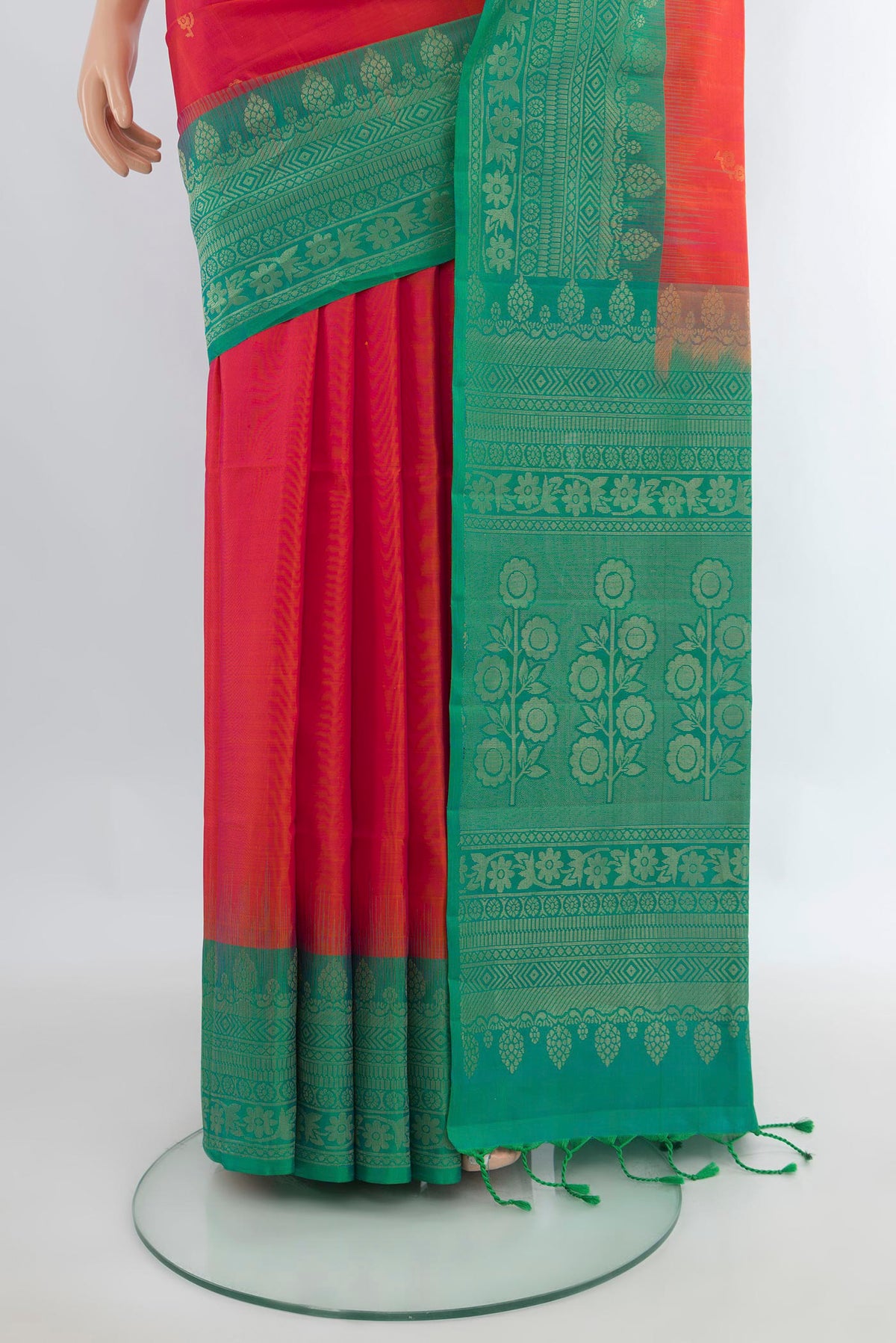 Pleats and pallu of Pure Silk Brick Orange Soft Saree with Zari Butta on the body and Zari Border. 