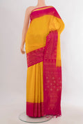 Pure Silk Mustard Soft Saree with Zari Butta on the body and Zari Border.  displayed on a mannequin