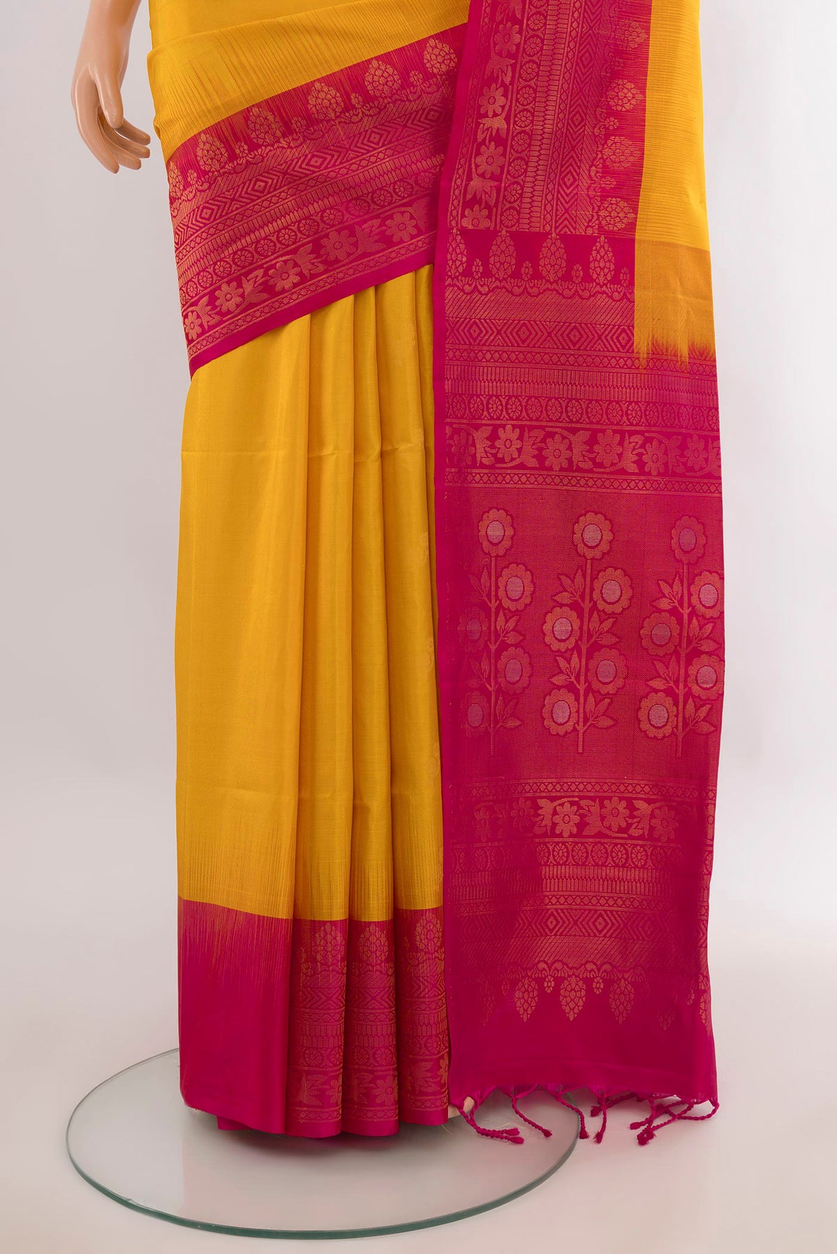 Pleats and pallu of Pure Silk Mustard Soft Saree with Zari Butta on the body and Zari Border. 