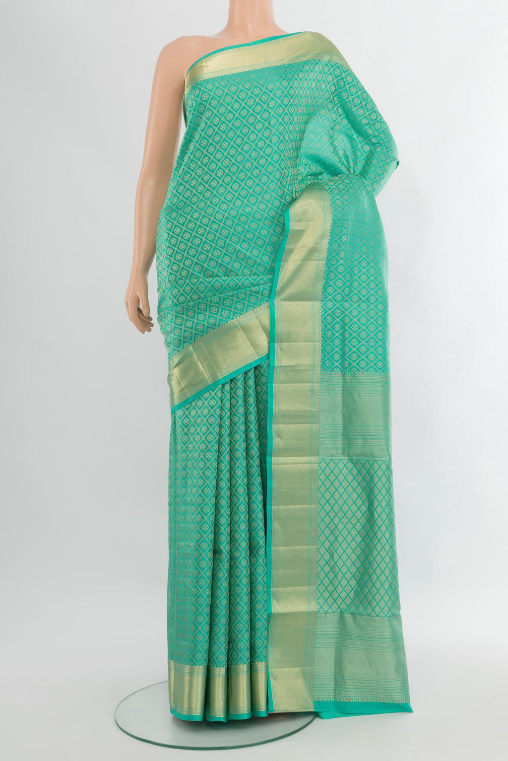 Turquoise Soft Silk Saree with Zari Brocade on the body and Zari Border.  displayed on a mannequin