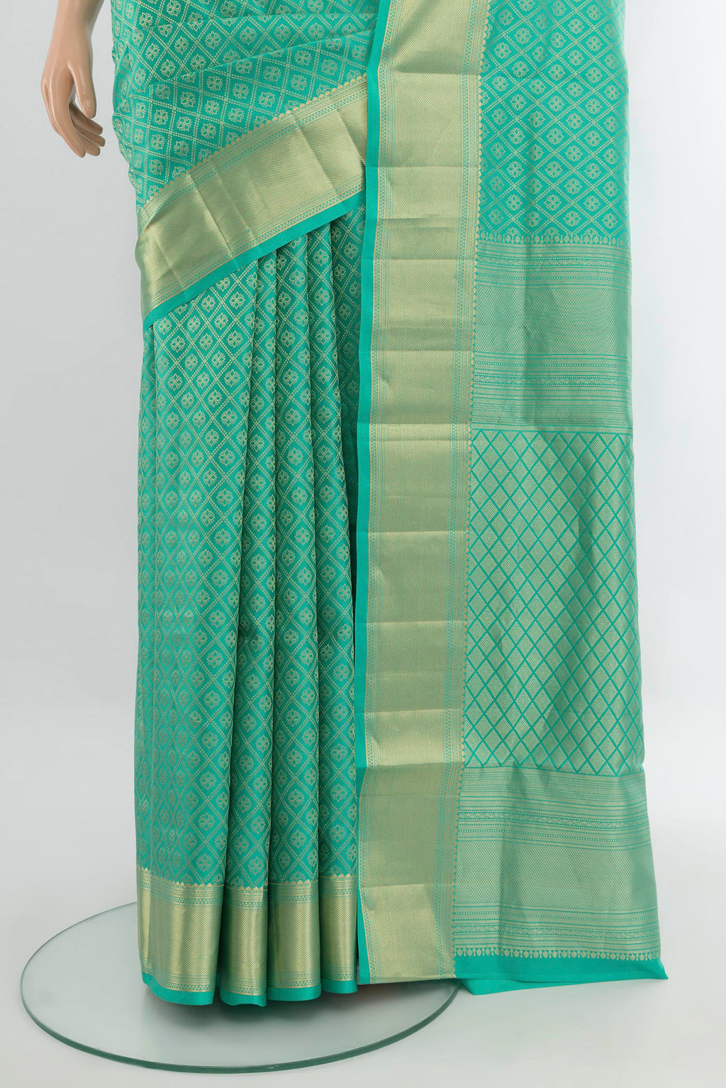Pleats and pallu of Turquoise Soft Silk Saree with Zari Brocade on the body and Zari Border. 