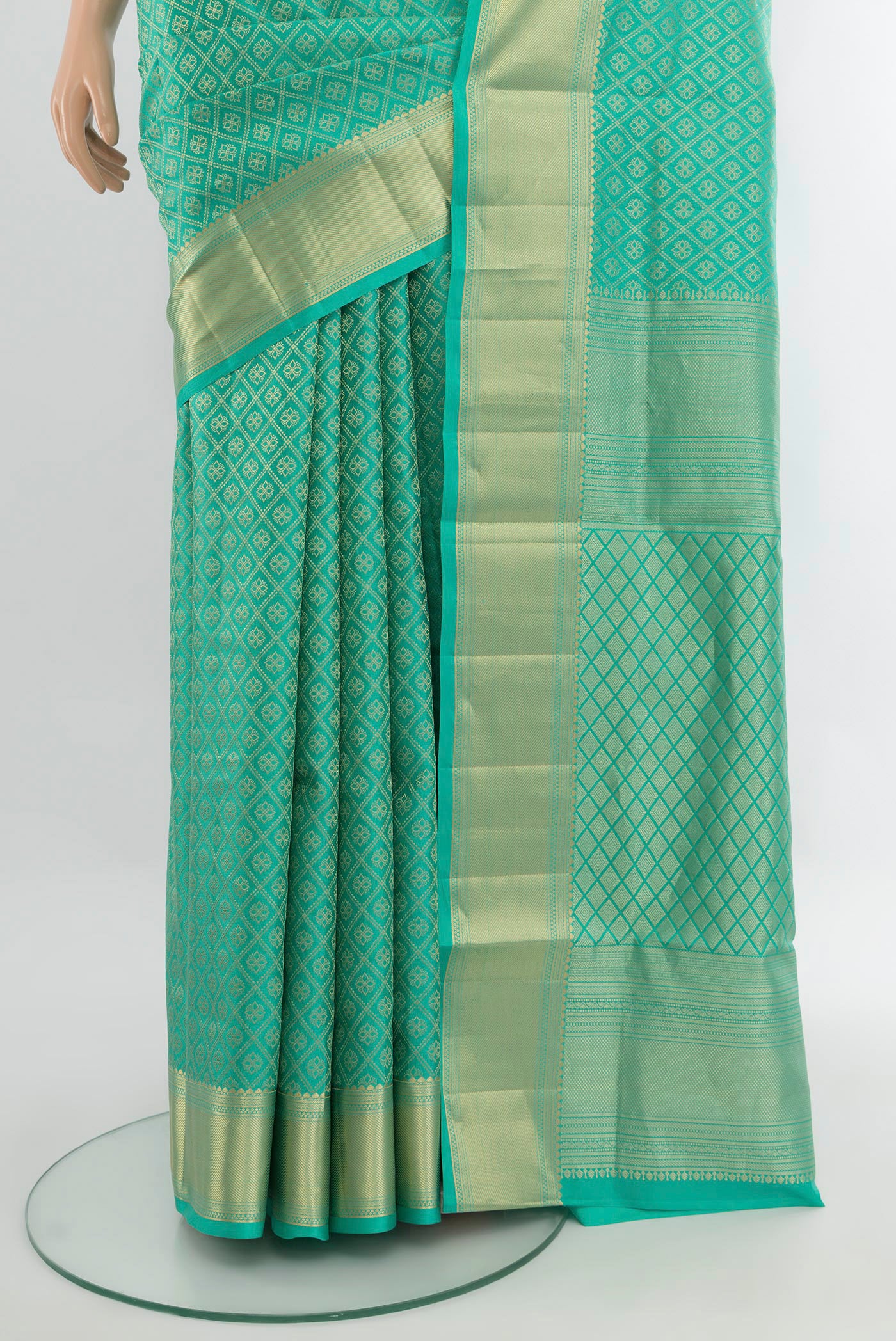 Pleats and pallu of Turquoise Soft Silk Saree with Zari Brocade on the body and Zari Border. 