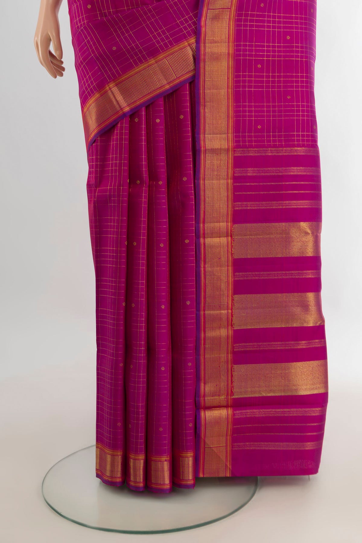 Pleats and pallu of Pure Silk Pure Zari Magenta Kanchipuram Saree with Checked design on the body and Zari Border. 