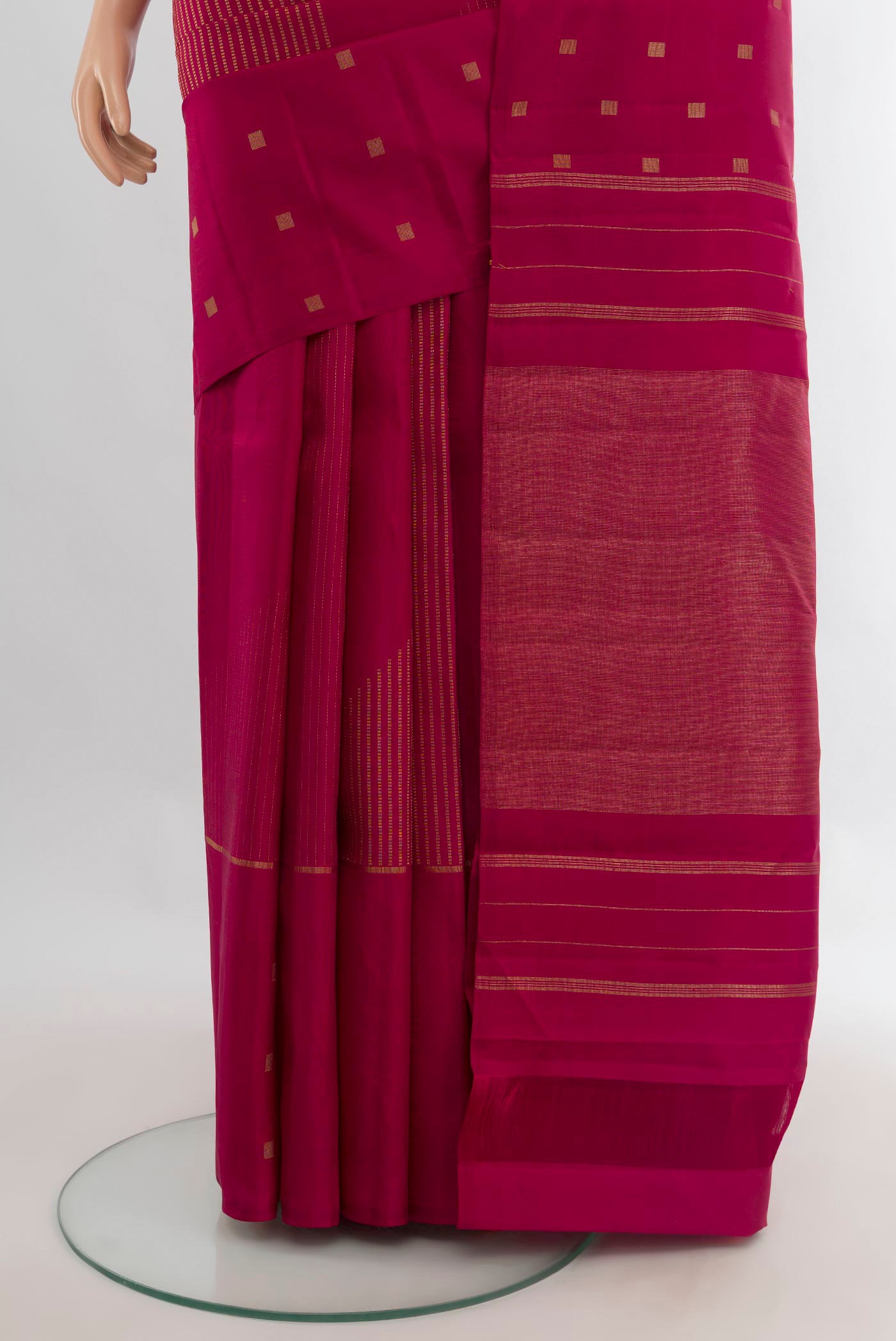 Pleats and pallu of Pure Silk Pure Zari Dark Pink Kanchipuram Saree with Zari Butta on the body and Without Border. 