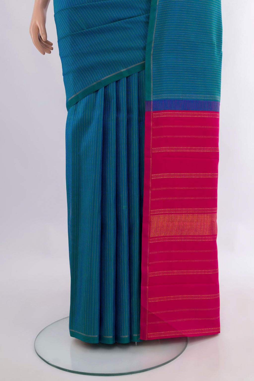 Pleats and pallu of Pure Silk Pure Zari Peacock Blue Kanjivaram Saree with Stripes on the body and Thin Zari Line. 